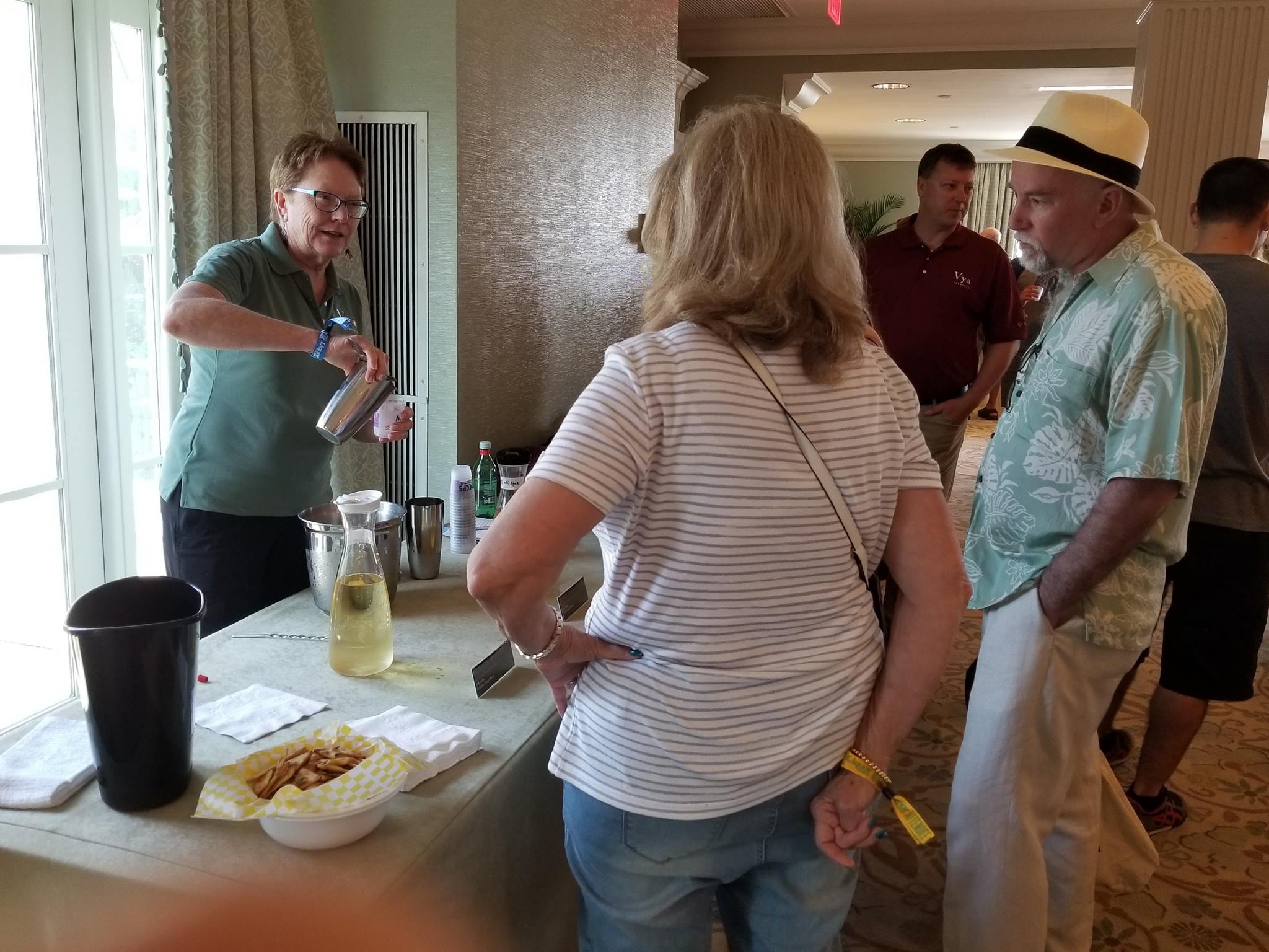 Laurel Quady talking to two attendees at the vya vermouth tasting and seminar at tales of the cocktail.