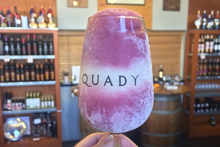 Electra Moscato and Red Electra Moscato Frozen into a Slushie in a Quady wine glass.