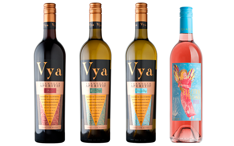 Four bottles lined up showing three different Vya Vermouth wine flavors and one moscato.