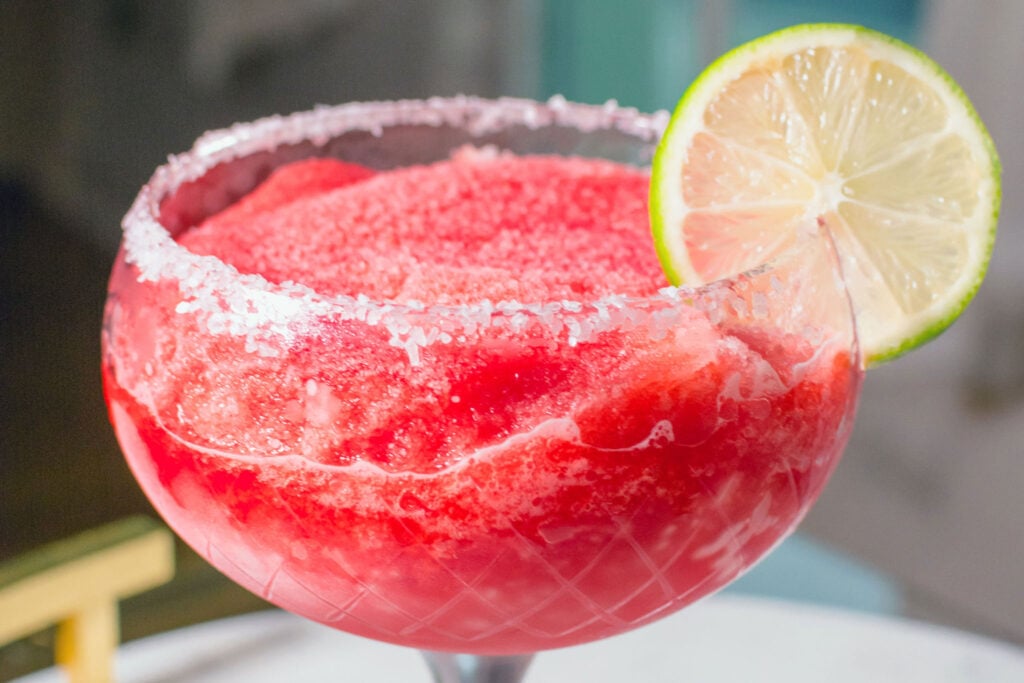 Red Electra Moscato-rita Moscato Margarita wine cocktail in a glass with lime garnish
