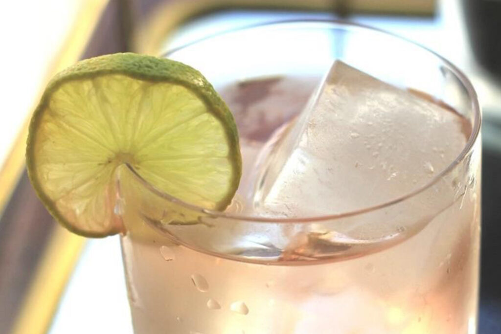 Electra Rose Moscato-Rita wine cocktail recipe in rocks glass with lime wheel garnish