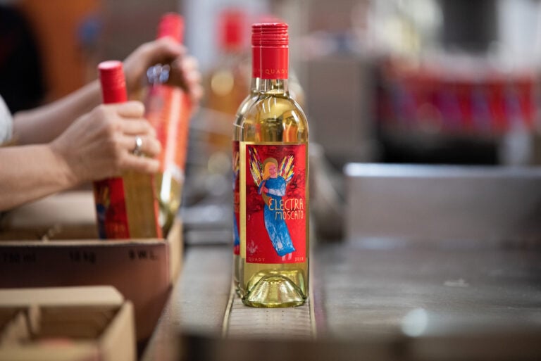 Electra Moscato wine being bottled and packaged.