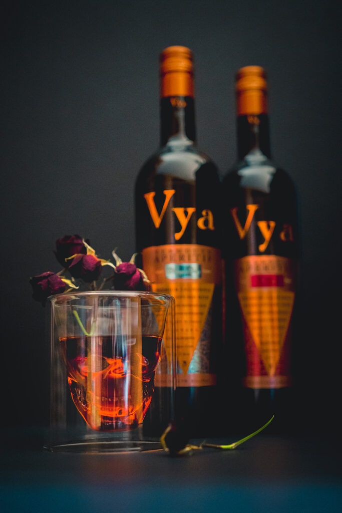 Vya con Dios Tequila Cocktail with bottles of Vya Sweet and Whisper Dry Vermouths