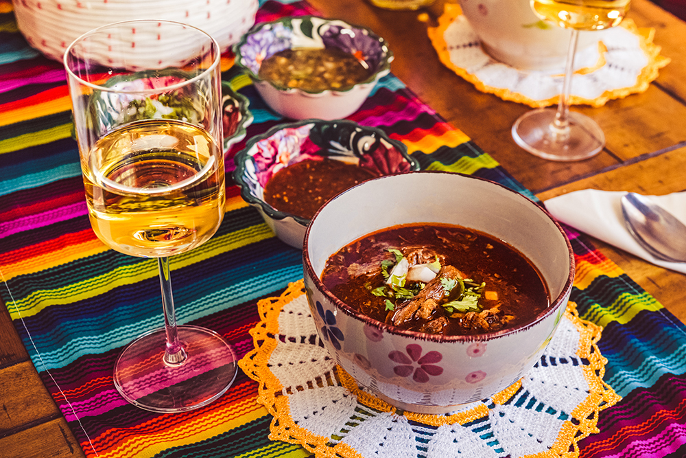 Birria with a glass of Electra Moscato