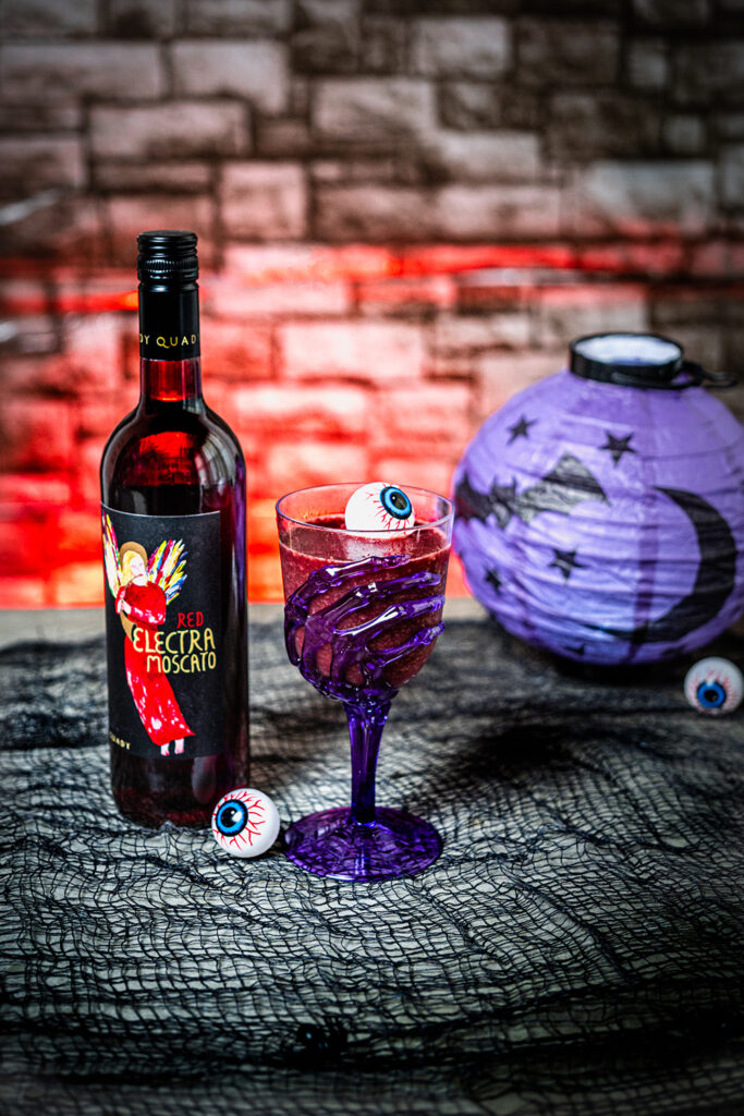 Vampire Bite Halloween Slushie with Red Electra Moscato and plastic eyeballs