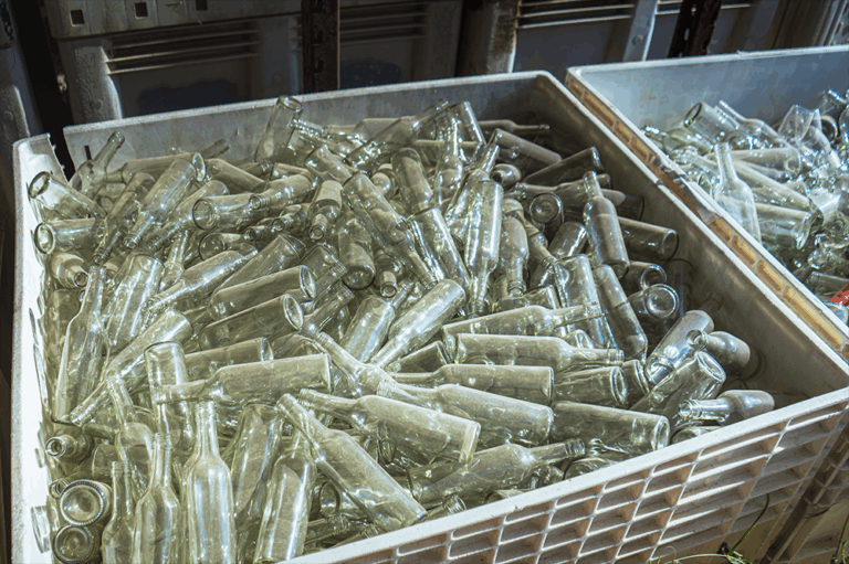 A bin of empty wine bottles for recycling