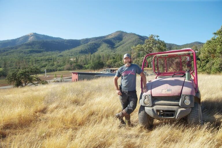 Herb Quady next to a 2004 Kawasaki