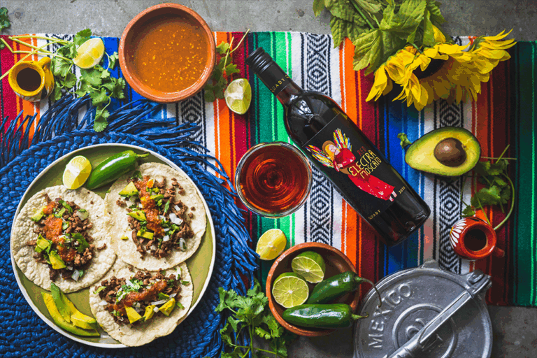 Red Electra Moscato with salsa and a plate of tacos